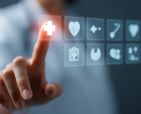 Doctor touching a digital interface with medical icons in a mode