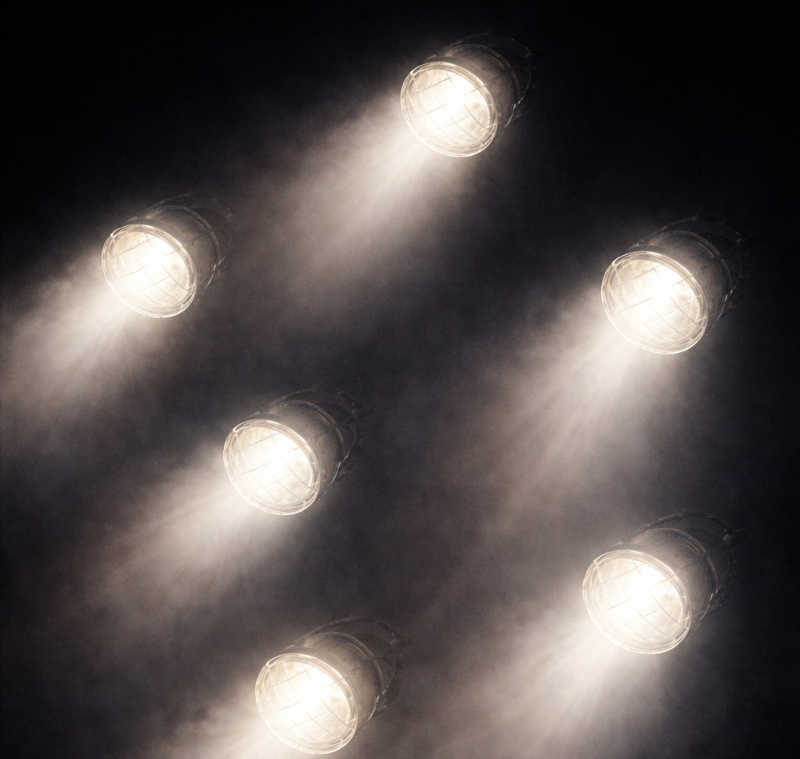 AI-generated square image of multiple irregular white lights glowing against a black background